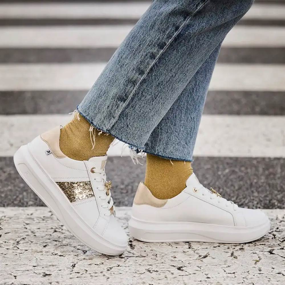 white shoes with gold by rieker square image